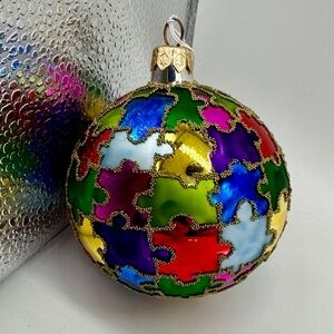 Multicolor puzzle piece designed holiday ornament. Excellent condition!